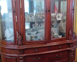 China cabinet with matching table abd chairs. Good quality.