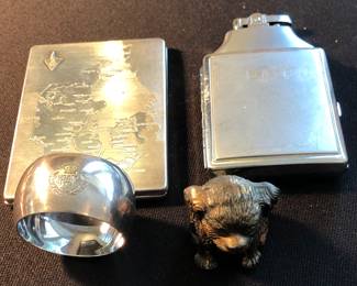 Vintage 1900s Puppy Dog Crane Breed Caskets Funeral Advertising Paperweight, WW2 Royal Air Force Napkin Ring, and Vintage Cigarette Cases