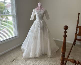Vintage wedding dress over 60 yrs old. Has been stored in professional cleaned sealed box