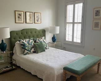 Queen bed with linens and pillows