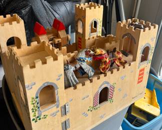 Wooden castle and knights with horses