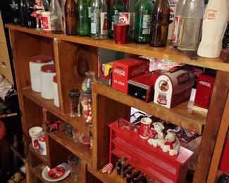 various vintage bottles and Coca Cola memorabilia