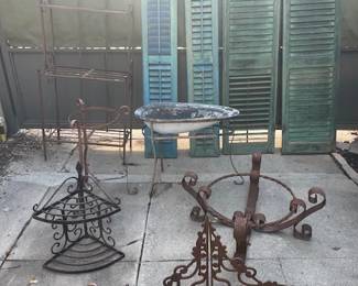 Outdoor gardening items...wrought iron plant stands, wrought iron hanging planters, wrought iron shelves, and vintage shutters.