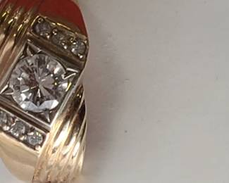 Man's 14K ring featuring a 1 ct center stone