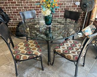 Metal and glass table with 4 heavy metal chairs