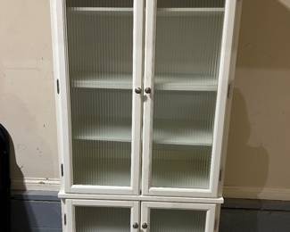 white cabinet with glass doors