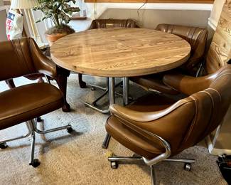 Mid-Century Modern FANTASTIC!!! Woodgrain round table, 42" in diameter WITH a 17 inch leaf! The Chrome base is awesome! 4 very comfy upholstered chairs...on rollers! Perfect for den, Game room, Man Cave...run don't walk...this will NOT last!