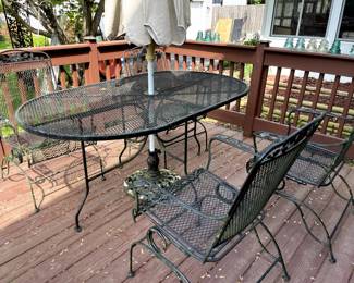 Woodard wrought iron oval patio table and 4 chairs! A little clean up and you are good for another 40 years! This stuff lasts forever!