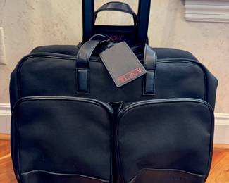 SOLD--Tumi rolling carry on bag in excellent used condition