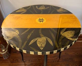$450; artisan crafted lacquered side table with botanical accents, black and ivory check and metal legs; 30"d x 30"h