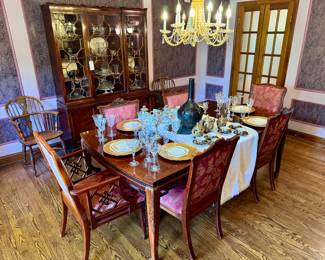 ($1200; Chinoiserie style table with carved leaves on the legs and open carvings on the corners, including 2 leaves; 45x66x29.5; leaves are 15" each opening it up to 96") ($1400; set of 6 handcrafted dining chairs with Chinoiserie accents and upholstery with leaf fans on upper edge of side chairs; 2 chairs are arm chairs for host and hostess)