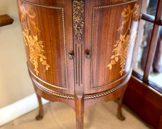 $500 each (2 available); demilune cabinet with inlay marquetry woodwork on curved doors and carved woodwork and marble top