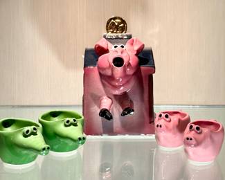 $400; 5 piece pig and alligator tea set by John Groth Studios; teapot 8"h