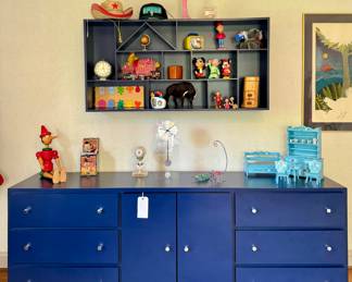 Shop this sale in person for a large collection of vintage children's toys. ($300; full size blue dresser with 6 drawers and cabinet and chrome hardware) ($250; blue display shelf)