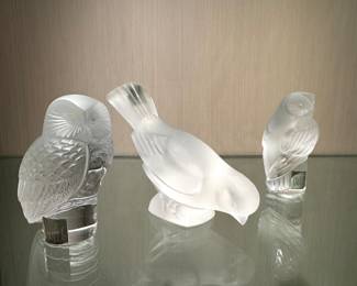 (left to right) ($150; Lalique crystal owl; 3.5"h) ($200; Lalique crystal bird; 4"h) ($150; Lalique crystal owl; 3.5"h)