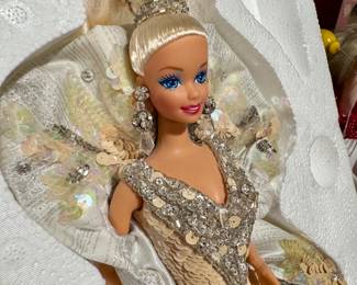 Two tables full of collector Barbies and Madame Alexander dolls. Visit the sale in person to see entire collection.