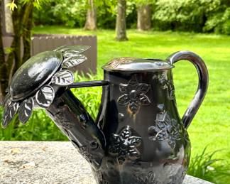 $150; MacKenzie Childs sunflower black metal watering can, has some patina but still is water tight