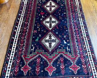 SOLD-- hand woven wool rug with tribal elements, deep navy blues, reds and ivory; approx 4'x6'