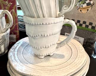 Variety of Vietri dinner ware available at this sale. ($80; set of 4 salad plates) ($350; set of 7 dinner plates) ($28 each-5 available; striped coffee mugs) ($28; wave coffee mug)