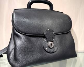 $200; Ralph Lauren Ricky flap black leather bag. Keys available. However, we can't get it open...can you? :)