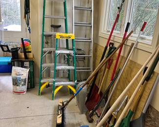 Many ladders, rakes, shovels and garden tools!