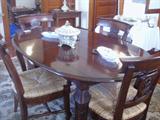 Beautiful dining table has large leaf and 6 rush seat chairs...