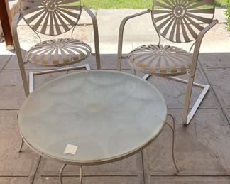2 metal patio chairs and patio table