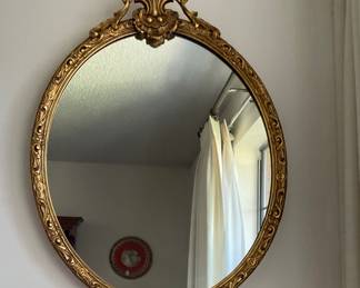 Oval gold mirror