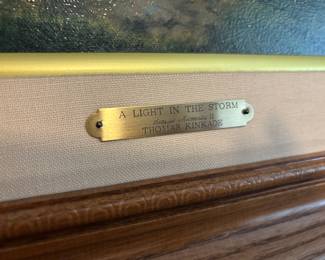 Framed Canvas Print "A Light in the Storm" by Thomas Kinkade