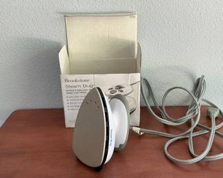 Mini steam iron.