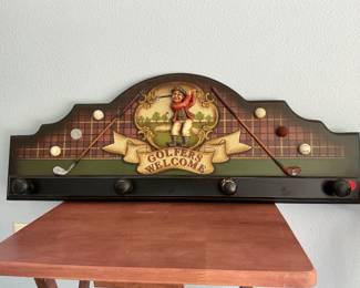 Golf hat/coat wall hanger.