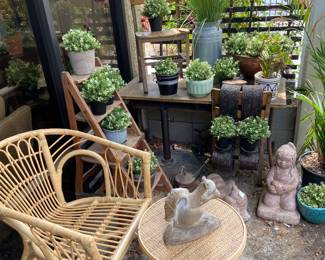 rattan chair, side table, sculptures