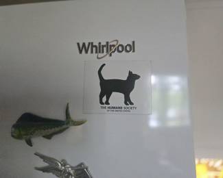 Whirlpool Side-by-Side Refrigerator with Ice/Water	White Whirlpool refrigerator/freezer with side-by-side doors and in-door dispenser. Clean and functional.
