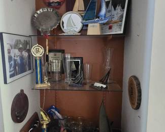 ⛵ Nautical Decor & Sailing Memorabilia Collection
Set sail with this impressive collection of sailing-themed memorabilia, including model boats, framed photos, trophies, drinkware, regatta awards, and engraved silver plates. Perfect for lake house decor, yacht club enthusiasts, or coastal homes.
Sold as a full lot or individually upon request.

