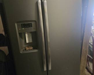 GE Stainless Side-by-Side Refrigerator	Modern GE fridge in brushed stainless steel with water/ice dispenser. Sleek and versatile.
