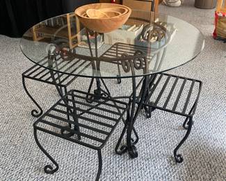 Wrought iron and glass.