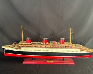 Vintage handmade wooden model ship of the S.S. Normandie.