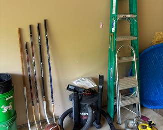 Sports items / hockey sticks, ladders, craftsman shop vac