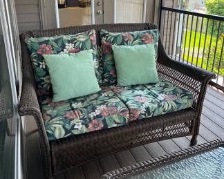 Wicker outdoor loveseat.