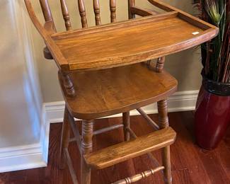 Oak wooden highchair.