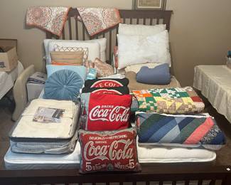 Quilts, blankets and pillows. Queen bed.