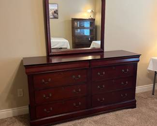 Cherry dresser with mirror.