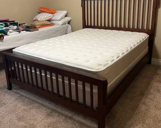 Queen wooden bed.