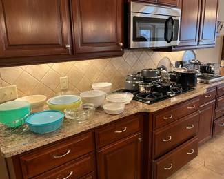 Mixing bowls, dishes and pots and pans.