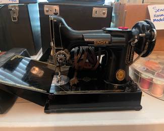 Featherweight, Black, Singer Sewing Machine in perfect condition with case.