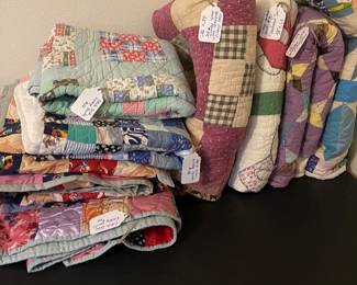Several vintage, handmade Quilts.