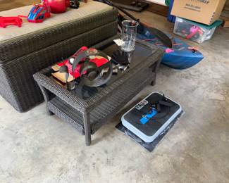 Resin wicker coffee table and resin wicker porch storage box.