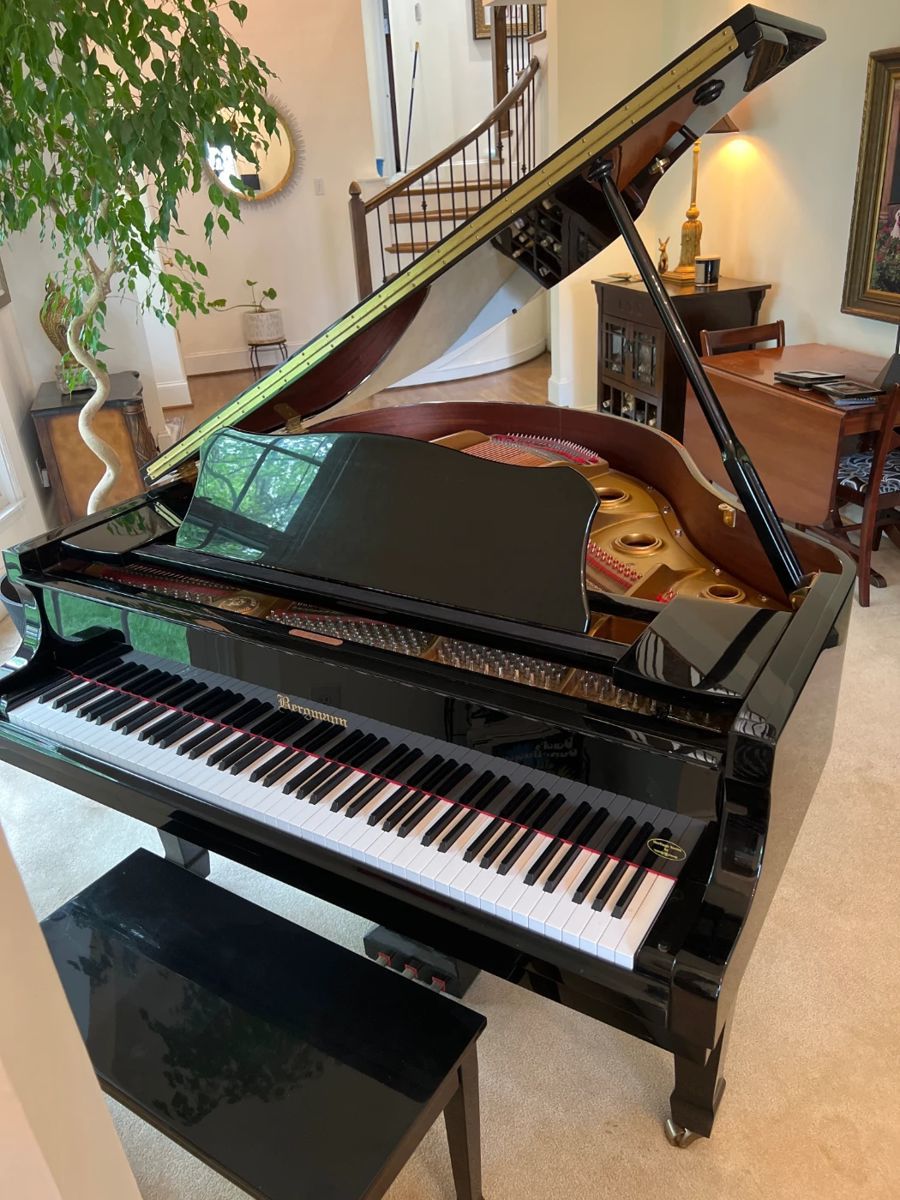-$4,000-STUNNING EXCELLENT CONDITION BERGMANN BABY GRAND PIANO -TG-150 Black Polished Lacquer Bergmann Heritage Series baby grand piano are made with top quality materials and craftsmanship. The 4′ 11” TG-150 Model can accommodate small spaces but has the richness and evenness of sound of much larger grands. Features a Spruce Soundboard and Young Chang’s top of the line action components and felt. Original Black Piano Bench with Music Storage Included! Specifications: Dimensions: 59in. length, 57in. width, 39in. height. 88 Keys, Ebony Sharps, White Pyralin Keys. Manufacturer: Young-Chang. Professional Piano Moving Resource available for fee.