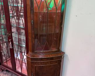One of TWO lighted mahogany corner cabinets