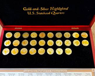 Gold and Silver Highlighted US Statehood Quarters in Display Case
